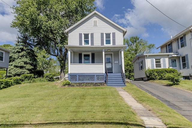 36 Broad St, Meriden, CT 06450 - view of front facade featuring covered porch and a front lawn
