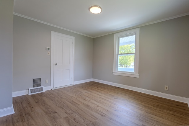 36 Broad St, Meriden, CT 06450 - empty room featuring wood finished floors, baseboards, and crown molding
