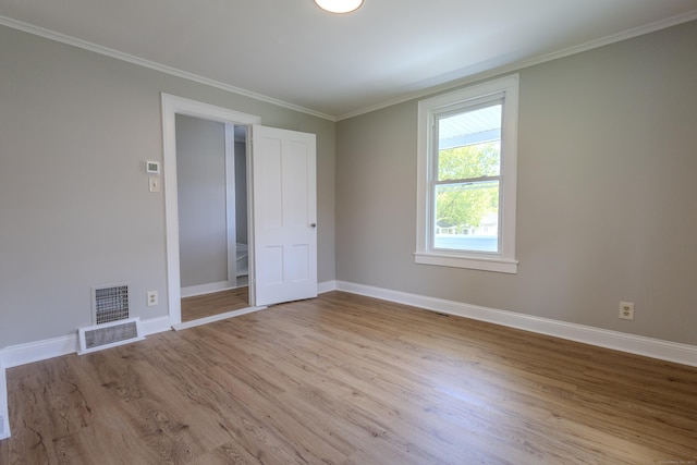 36 Broad St, Meriden, CT 06450 - empty room with wood finished floors, baseboards, and crown molding