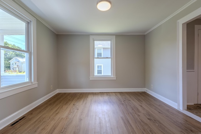 36 Broad St, Meriden, CT 06450 - unfurnished room with wood finished floors, baseboards, and ornamental molding
