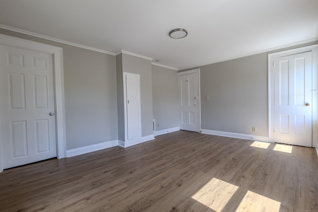 36 Broad St, Meriden, CT 06450 - unfurnished bedroom with baseboards, wood finished floors, and crown molding