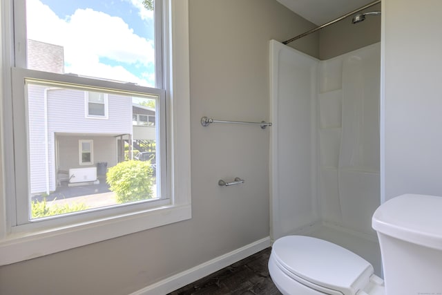 36 Broad St, Meriden, CT 06450 - full bathroom with toilet, a shower, and baseboards