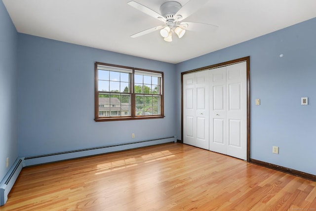 31 Elizabeth St, Shelton, CT 06484 - unfurnished bedroom with light wood-style floors, a closet, a baseboard heating unit, baseboards, and a ceiling fan