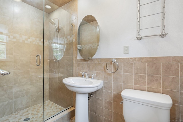 31 Elizabeth St, Shelton, CT 06484 - bathroom featuring toilet, a shower stall, and tile walls