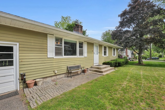 38 Craig Ave, Southington, CT 06489 - exterior space featuring a chimney and a yard