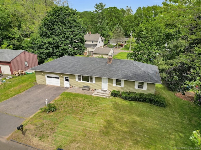 38 Craig Ave, Southington, CT 06489 - ranch-style house with driveway, a front lawn, a chimney, a garage, and a shingled roof