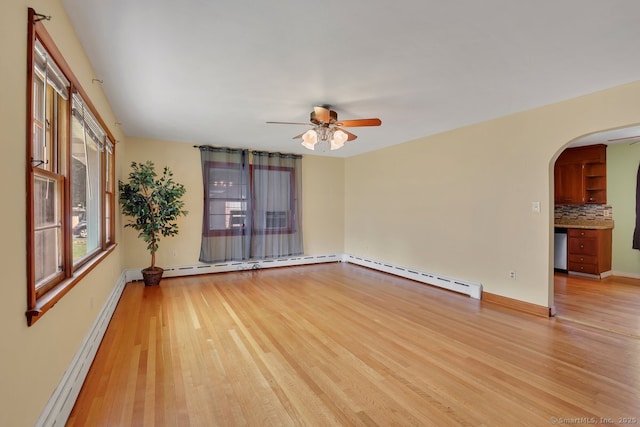 38 Craig Ave, Southington, CT 06489 - unfurnished room with light wood-style flooring, arched walkways, ceiling fan, a baseboard radiator, and baseboards