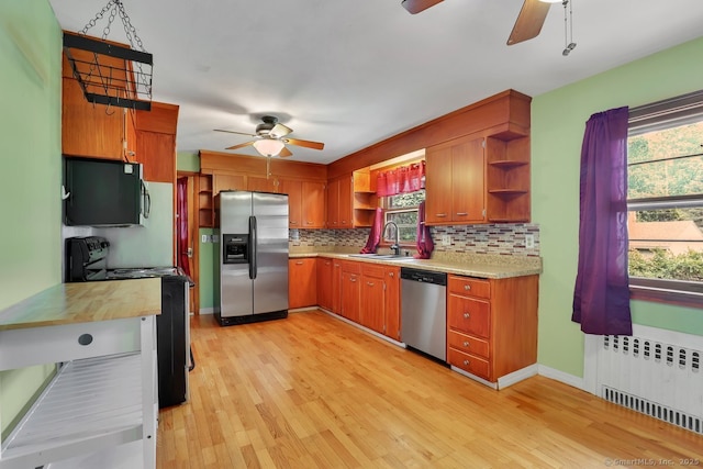 38 Craig Ave, Southington, CT 06489 - kitchen with black appliances, ceiling fan, open shelves, and a sink