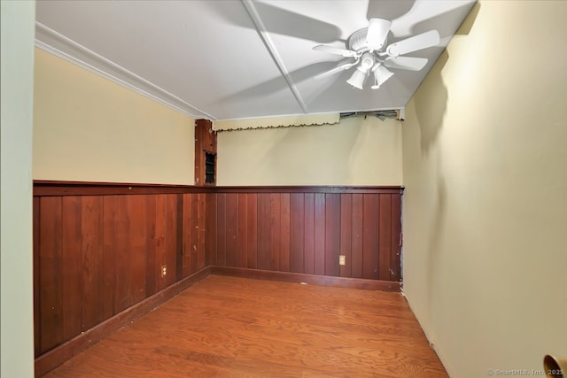 38 Craig Ave, Southington, CT 06489 - unfurnished room with wood finished floors, a wainscoted wall, a ceiling fan, and wood walls