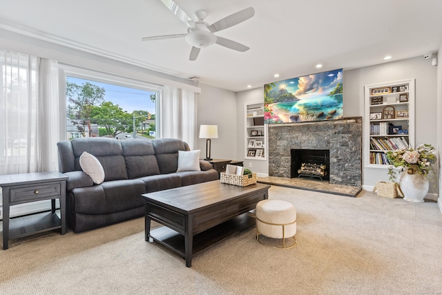 3657 Park Ave, Fairfield, CT 06825 - living area with a ceiling fan, light carpet, a stone fireplace, recessed lighting, and built in features