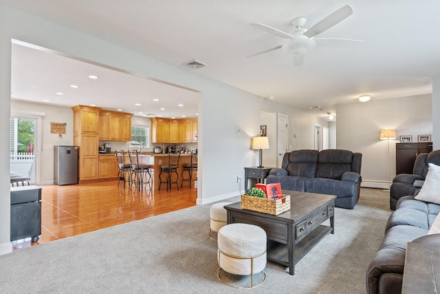 3657 Park Ave, Fairfield, CT 06825 - living room featuring light carpet, plenty of natural light, recessed lighting, baseboard heating, and a ceiling fan