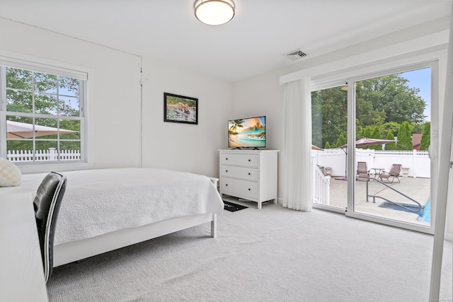 3657 Park Ave, Fairfield, CT 06825 - carpeted bedroom with multiple windows and access to outside