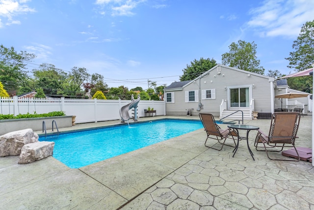 3657 Park Ave, Fairfield, CT 06825 - view of swimming pool featuring a water slide, a patio area, and a fenced backyard