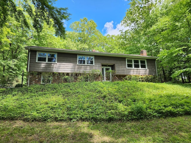 176 Hanover Rd, Newtown, CT 06470 - bi-level home featuring a chimney and brick siding