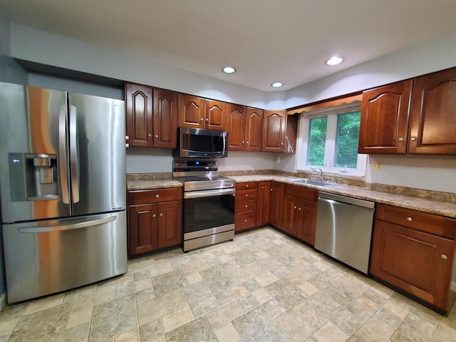176 Hanover Rd, Newtown, CT 06470 - kitchen featuring appliances with stainless steel finishes, a sink, stone finish floors, and recessed lighting