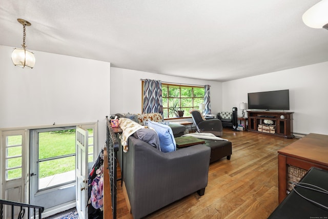 408 Reservoir Rd, Southbury, CT 06488 - living room featuring wood finished floors and a baseboard radiator