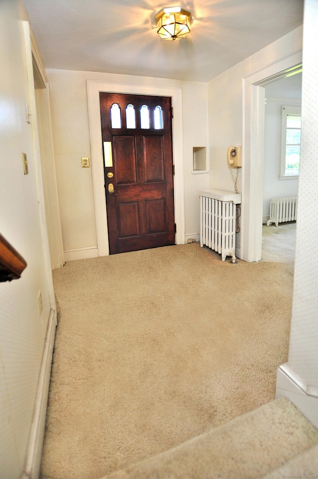 27 Prospect St, Bloomfield, CT 06002 - foyer featuring radiator and carpet floors