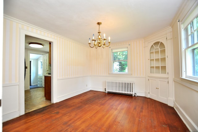 27 Prospect St, Bloomfield, CT 06002 - empty room featuring radiator heating unit, hardwood / wood-style flooring, a chandelier, ornamental molding, and baseboards