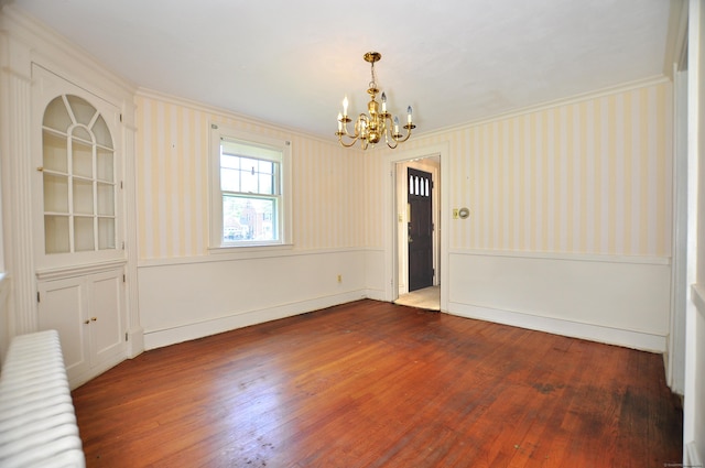 27 Prospect St, Bloomfield, CT 06002 - unfurnished dining area featuring crown molding, a chandelier, hardwood / wood-style flooring, wallpapered walls, and baseboards