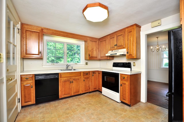 27 Prospect St, Bloomfield, CT 06002 - kitchen featuring black appliances, under cabinet range hood, a chandelier, a sink, and light countertops