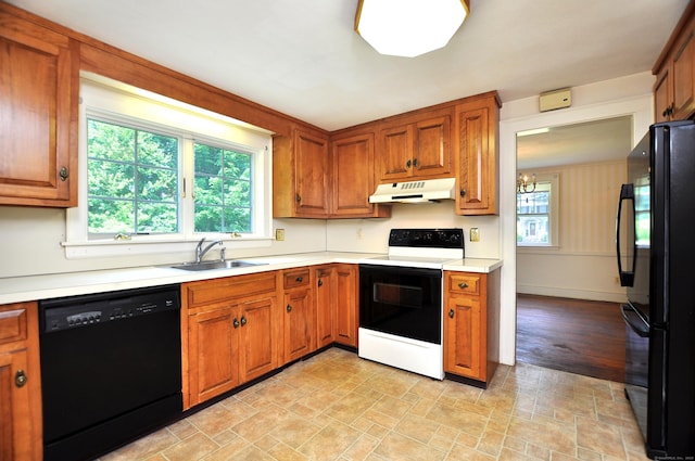 27 Prospect St, Bloomfield, CT 06002 - kitchen featuring black appliances, under cabinet range hood, a sink, and healthy amount of natural light