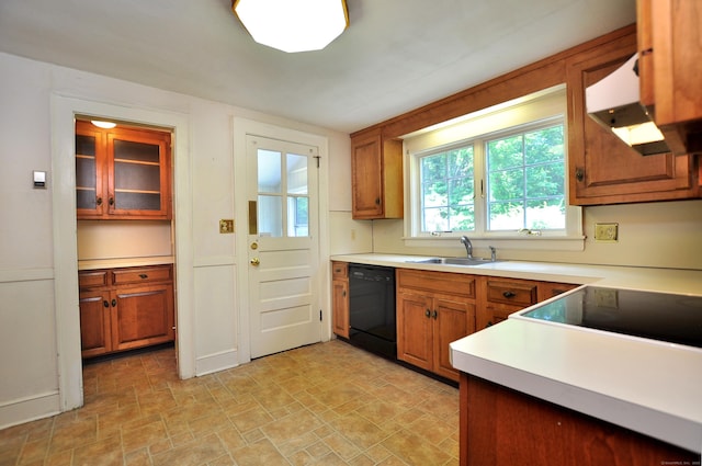27 Prospect St, Bloomfield, CT 06002 - kitchen with dishwasher, a sink, light countertops, brown cabinetry, and under cabinet range hood