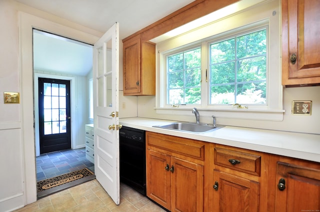 27 Prospect St, Bloomfield, CT 06002 - kitchen with black dishwasher, a sink, brown cabinets, light countertops, and plenty of natural light