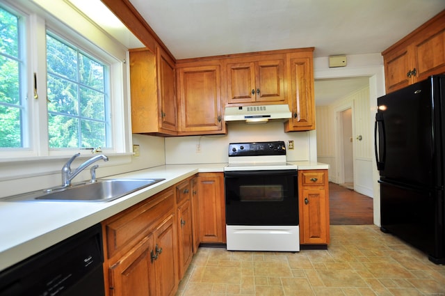 27 Prospect St, Bloomfield, CT 06002 - kitchen featuring black appliances, under cabinet range hood, a sink, and brown cabinetry