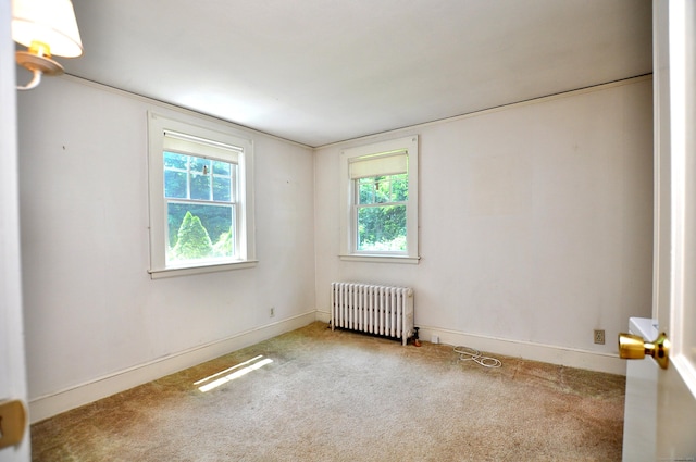 27 Prospect St, Bloomfield, CT 06002 - empty room featuring radiator heating unit, healthy amount of natural light, carpet, and baseboards