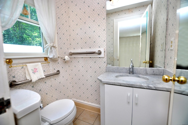 27 Prospect St, Bloomfield, CT 06002 - bathroom with toilet, vanity, tile patterned flooring, baseboards, and wallpapered walls