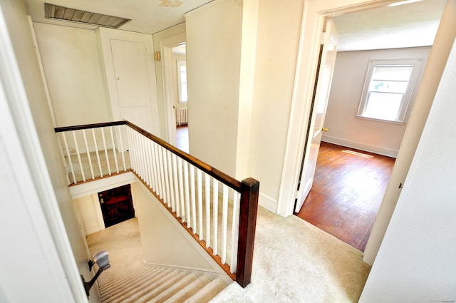 27 Prospect St, Bloomfield, CT 06002 - stairway with radiator, carpet, baseboards, and wood finished floors