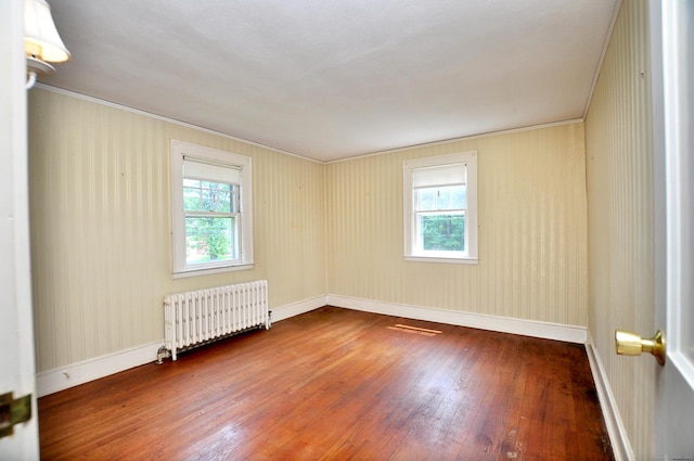27 Prospect St, Bloomfield, CT 06002 - spare room with radiator heating unit, hardwood / wood-style floors, ornamental molding, and baseboards