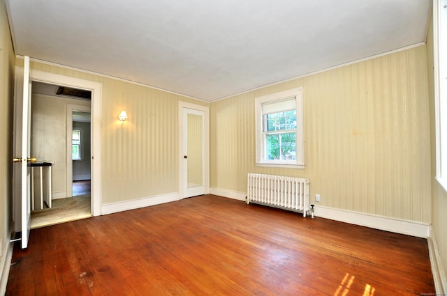 27 Prospect St, Bloomfield, CT 06002 - spare room with radiator, hardwood / wood-style floors, crown molding, and baseboards