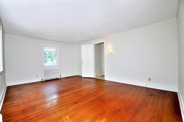 27 Prospect St, Bloomfield, CT 06002 - empty room with radiator, hardwood / wood-style floors, baseboards, and ornamental molding