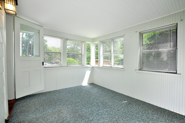 27 Prospect St, Bloomfield, CT 06002 - unfurnished sunroom with carpet, plenty of natural light, and wood walls