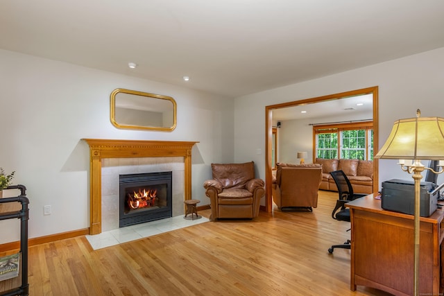 113 Charles St, Tolland, CT 06084 - office area with wood finished floors, a tiled fireplace, recessed lighting, and baseboards