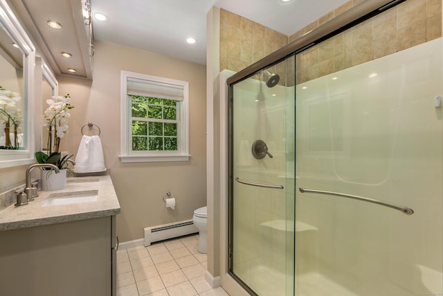 113 Charles St, Tolland, CT 06084 - bathroom with a baseboard heating unit, double vanity, tile patterned floors, a stall shower, and recessed lighting