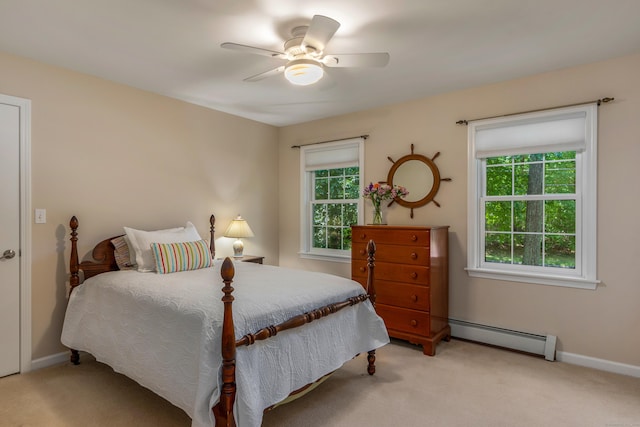 113 Charles St, Tolland, CT 06084 - bedroom with a baseboard heating unit, light colored carpet, and baseboards