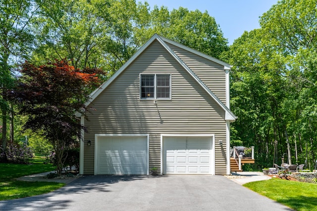 113 Charles St, Tolland, CT 06084 - view of home's exterior with a garage and driveway