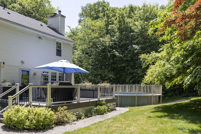 613 Ridgewood Rd, Middletown, CT 06457 - view of green lawn featuring a wooden deck and an outdoor pool