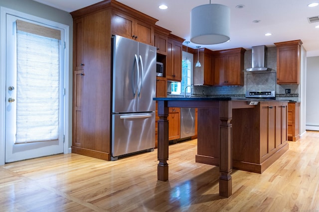 613 Ridgewood Rd, Middletown, CT 06457 - kitchen featuring wall chimney exhaust hood, appliances with stainless steel finishes, dark countertops, tasteful backsplash, and a center island