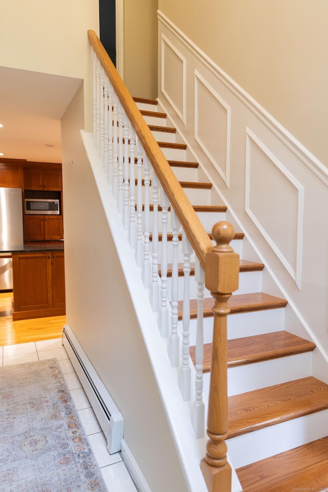 613 Ridgewood Rd, Middletown, CT 06457 - stairway featuring baseboard heating and tile patterned floors