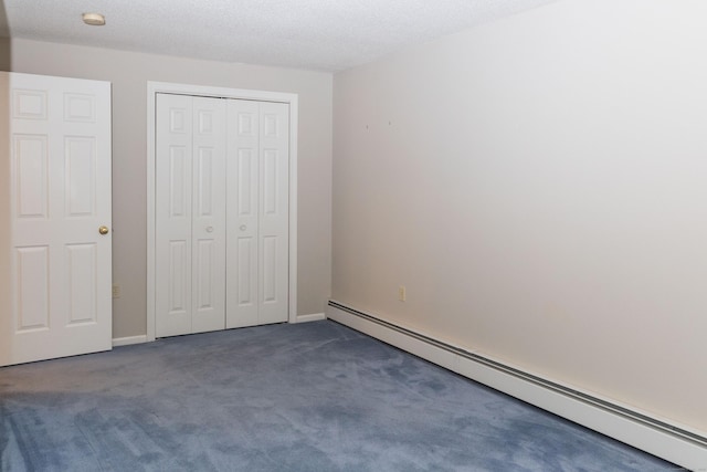 613 Ridgewood Rd, Middletown, CT 06457 - unfurnished bedroom featuring a baseboard radiator, carpet floors, and a closet