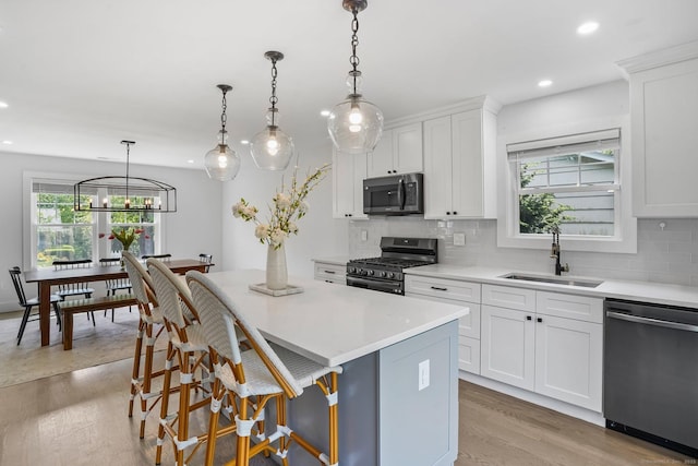 37 Highgate Rd, Trumbull, CT 06611 - kitchen with stainless steel appliances, a sink, recessed lighting, a kitchen island, and decorative backsplash