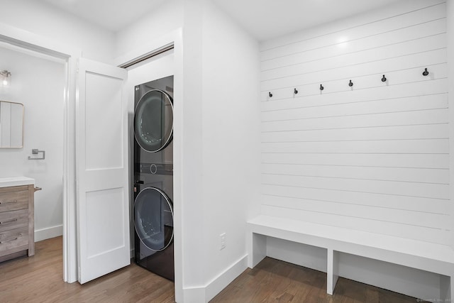 37 Highgate Rd, Trumbull, CT 06611 - washroom featuring stacked washer / dryer, wood finished floors, and baseboards