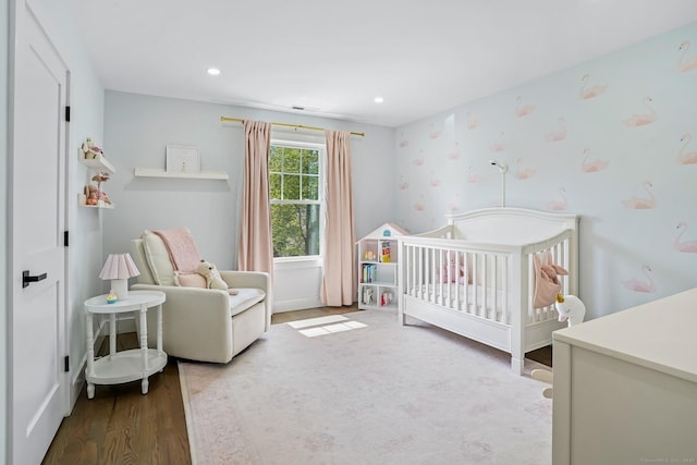 37 Highgate Rd, Trumbull, CT 06611 - bedroom featuring a crib and wood finished floors