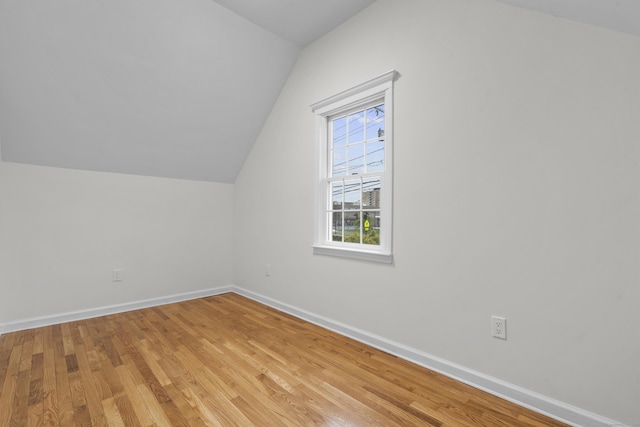 182 5th St, Stamford, CT 06905 - bonus room featuring lofted ceiling, baseboards, and light wood finished floors