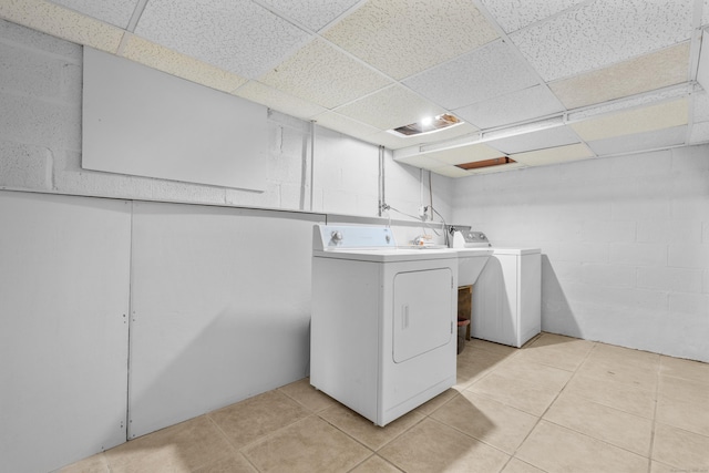 182 5th St, Stamford, CT 06905 - laundry area with washing machine and dryer and light tile patterned floors
