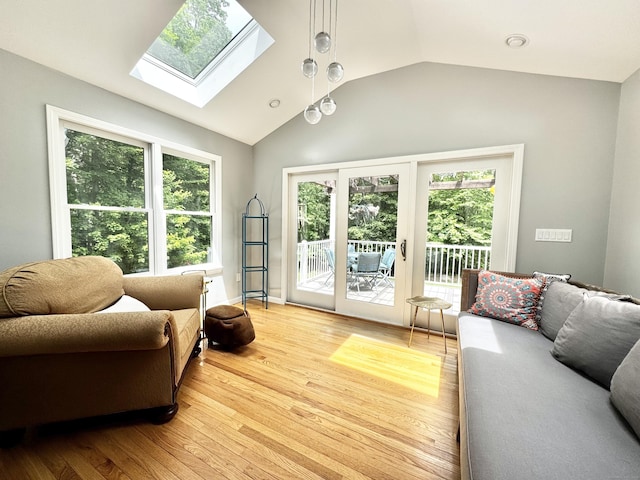 273 New London Rd, Colchester, CT 06415 - living area with vaulted ceiling, light wood-style floors, a skylight, and healthy amount of natural light