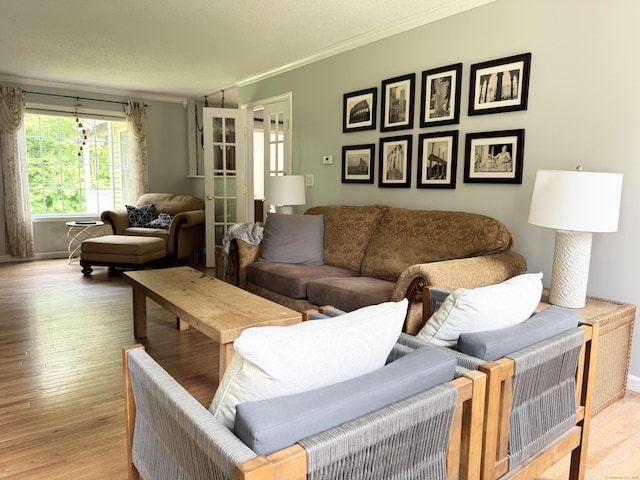 273 New London Rd, Colchester, CT 06415 - living room with ornamental molding, light wood-style flooring, french doors, and baseboards